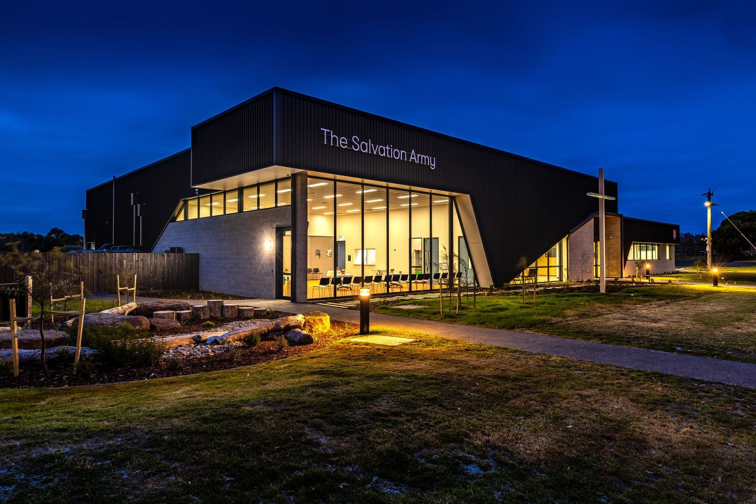 Exterior photograph of the Salvation Army Hub Warrnambool building at night.