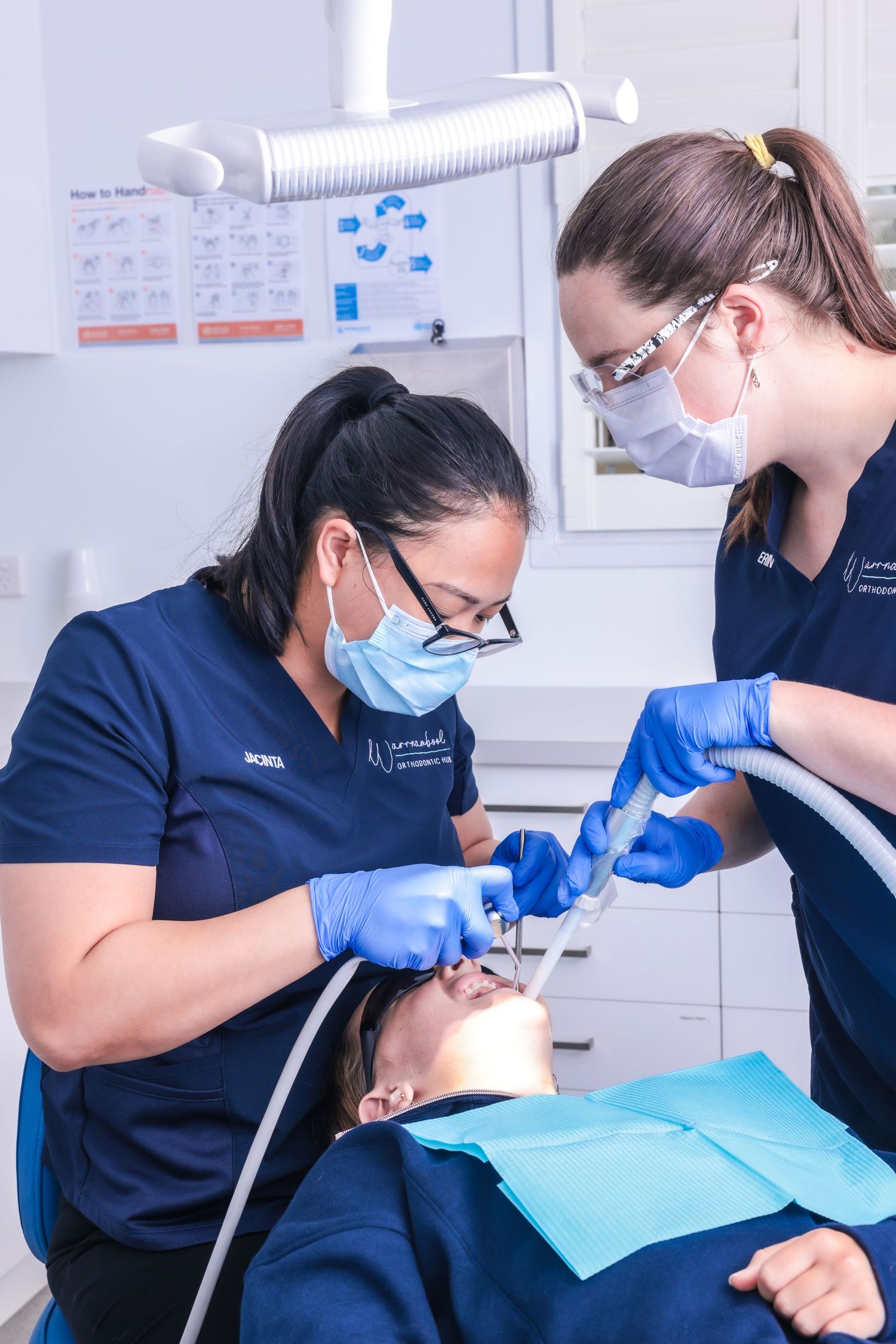 Photograph of an orthodontist treating a patient for the Braces N Faces brand.