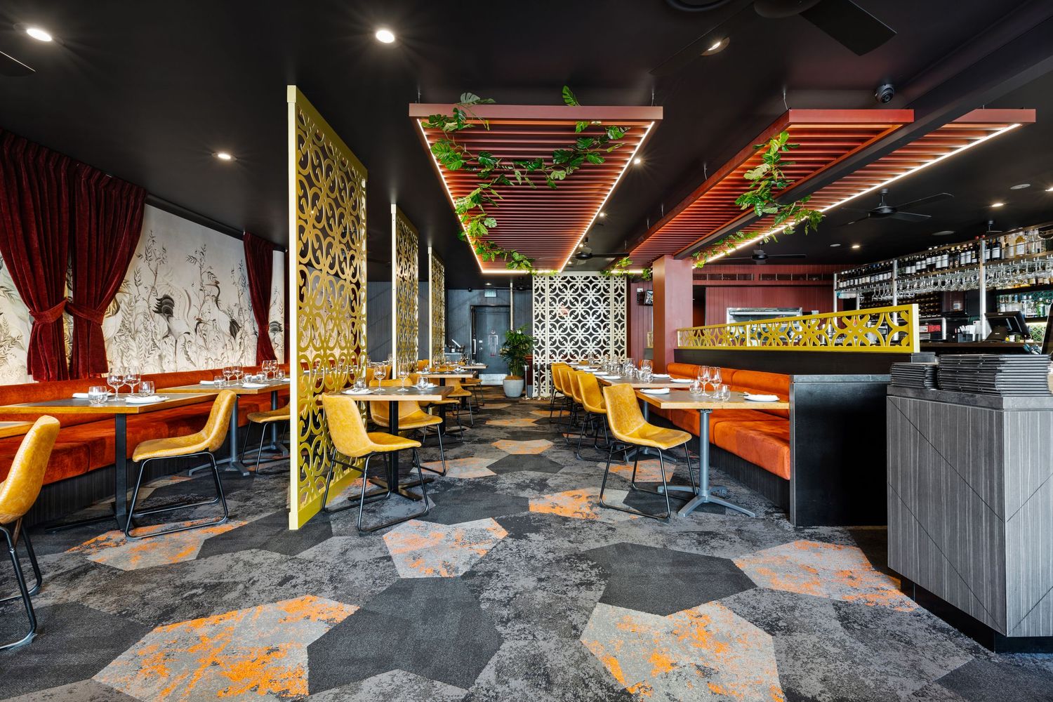 Interior photograph of a colourful fast food restaurant fit-out with booth seating.