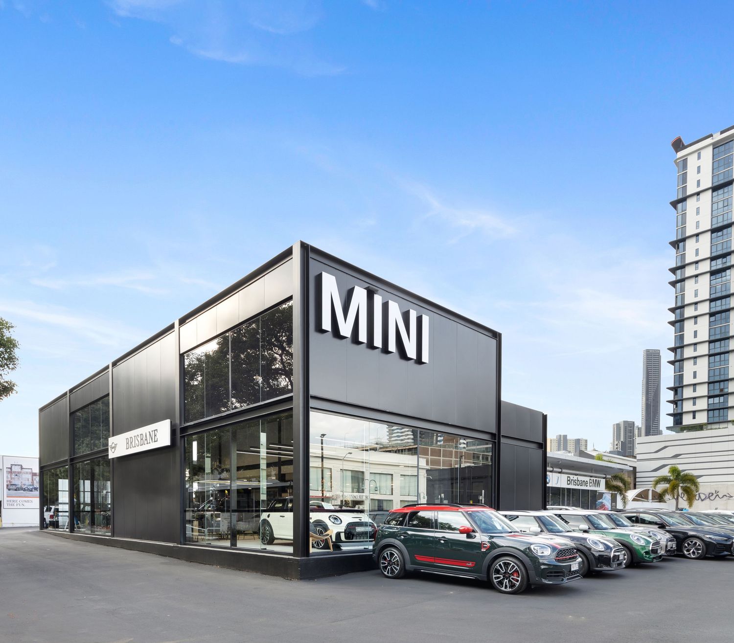 Exterior photograph of a MINI car dealership showroom building.