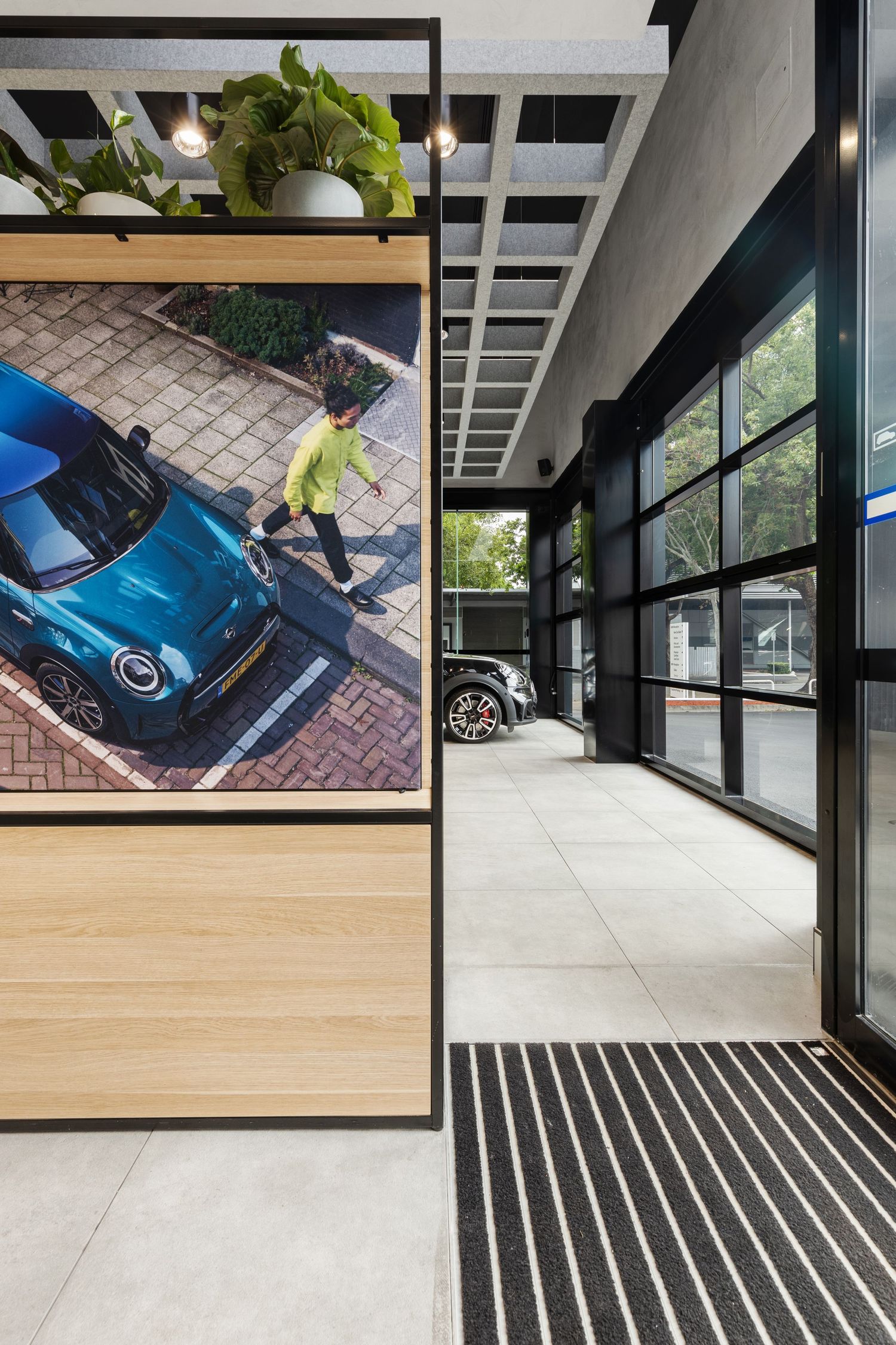 Interior photograph of a modern home entry and garage space.