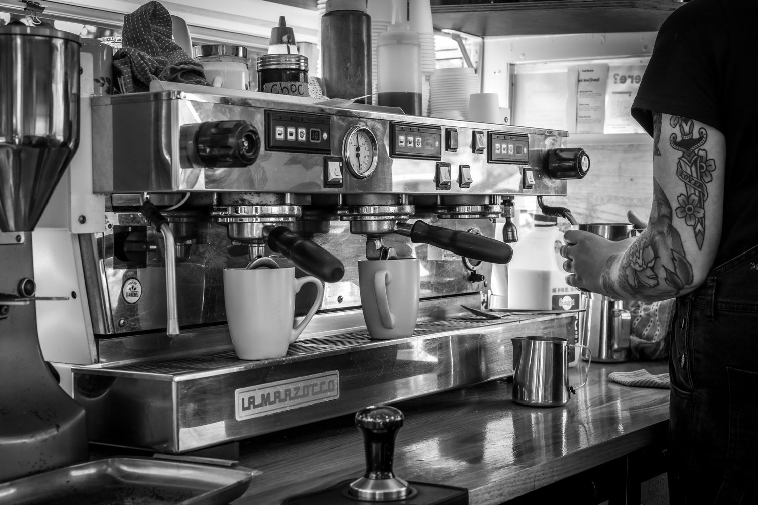 Black and white photograph of an espresso machine on the Pleasant Hill coffee van.