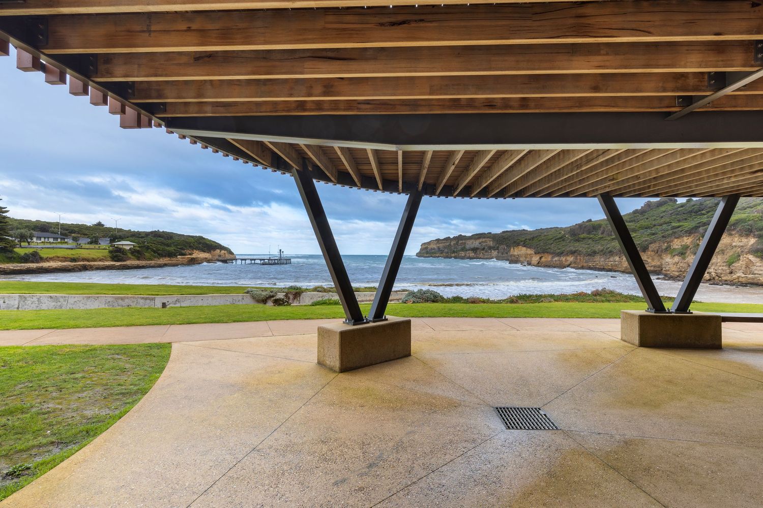 Timber-slatted coastal shelter structure overlooking a bay in South West Victoria.