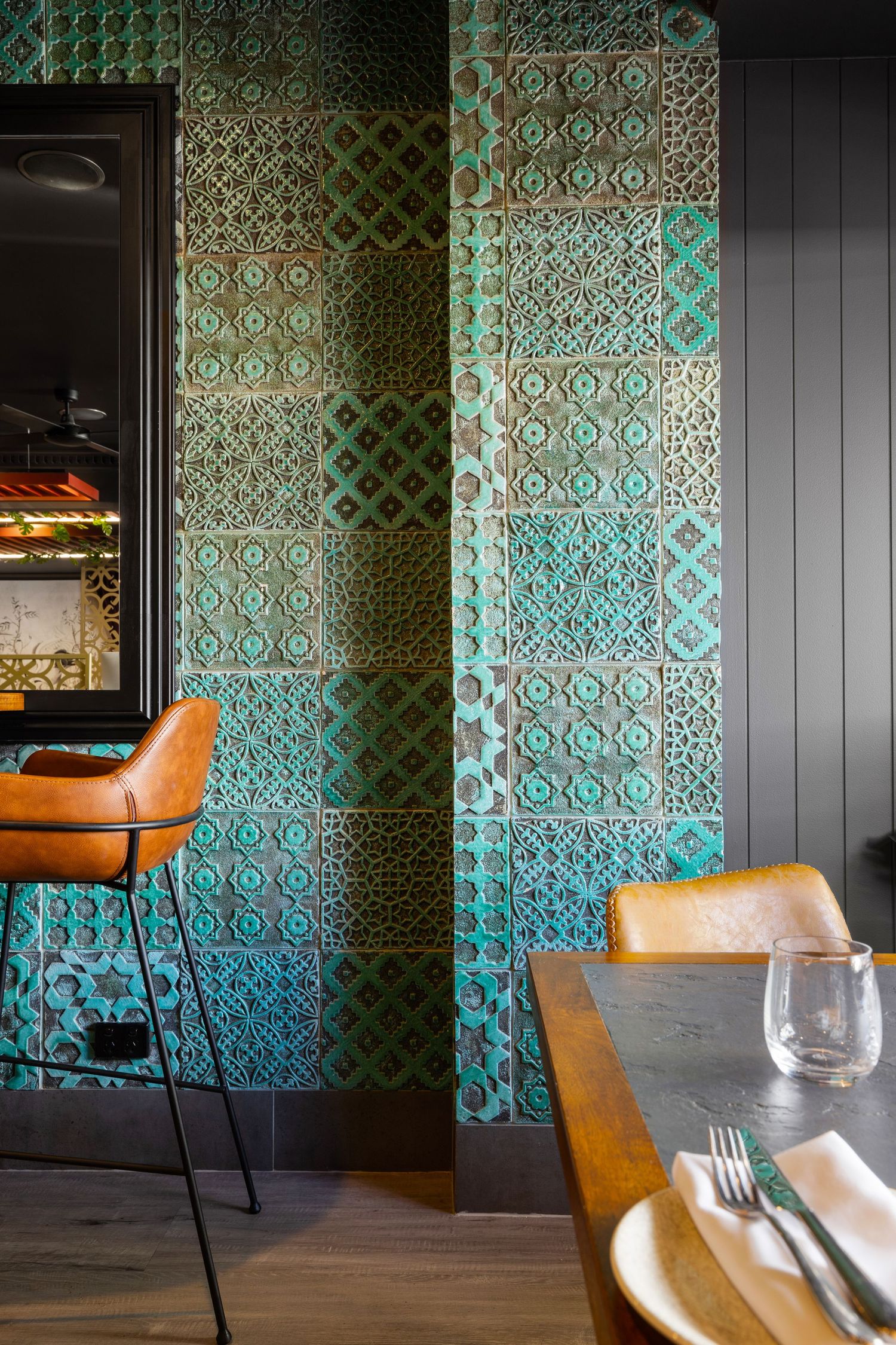 Interior photograph of a decorative patterned feature wall in a hospitality fit-out.