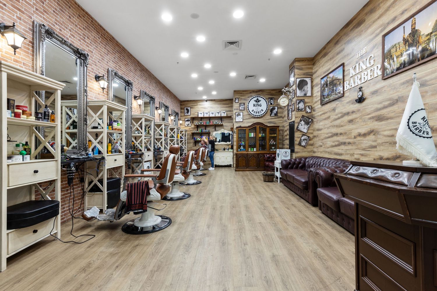 Interior photograph of a barbershop with styling chairs and timber fit-out.