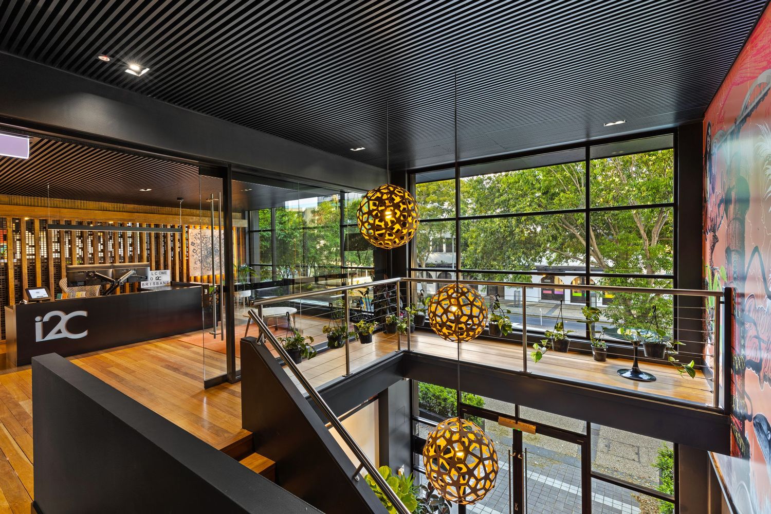 Interior photograph of a restaurant fit-out with timber bar and pendant lighting.