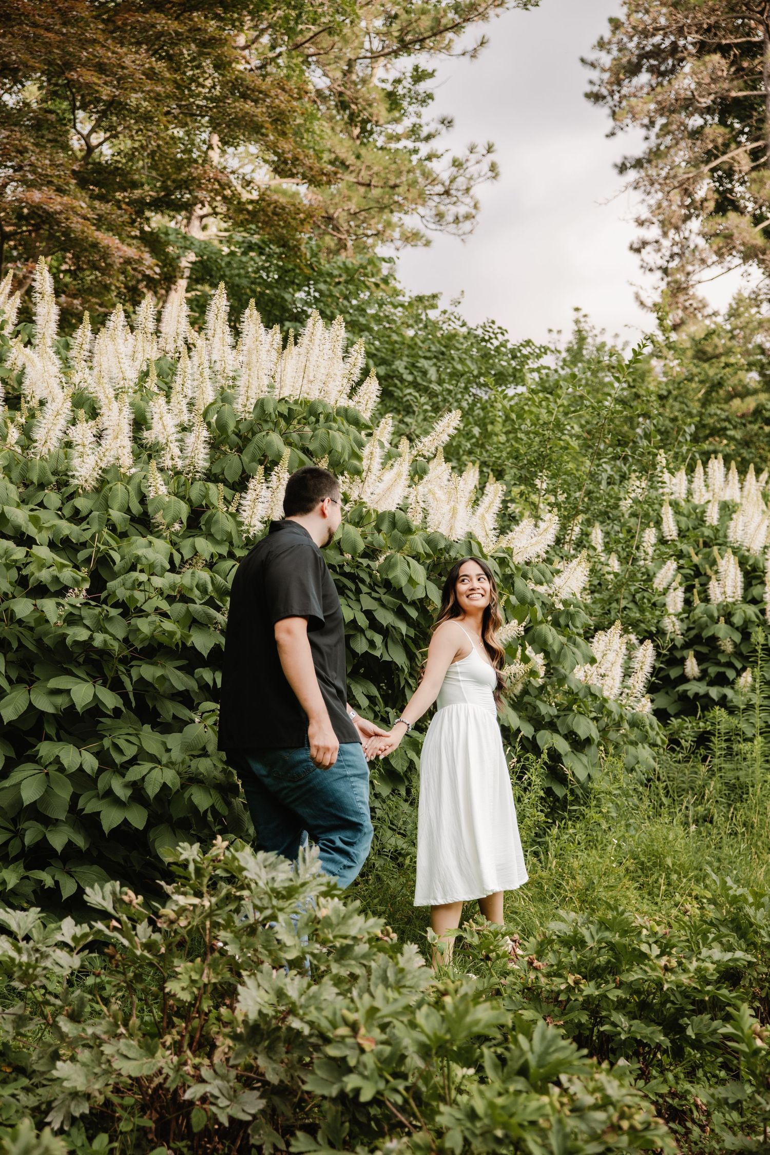 Couple walks through the UM Arb by Rachel Martinez Photography, Michigan Wedding photographer