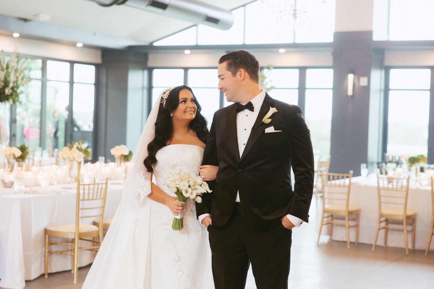 Couple poses at their reception in Ypsilanti Michigan by Rachel Martinez Photography, Michigan wedding photographer