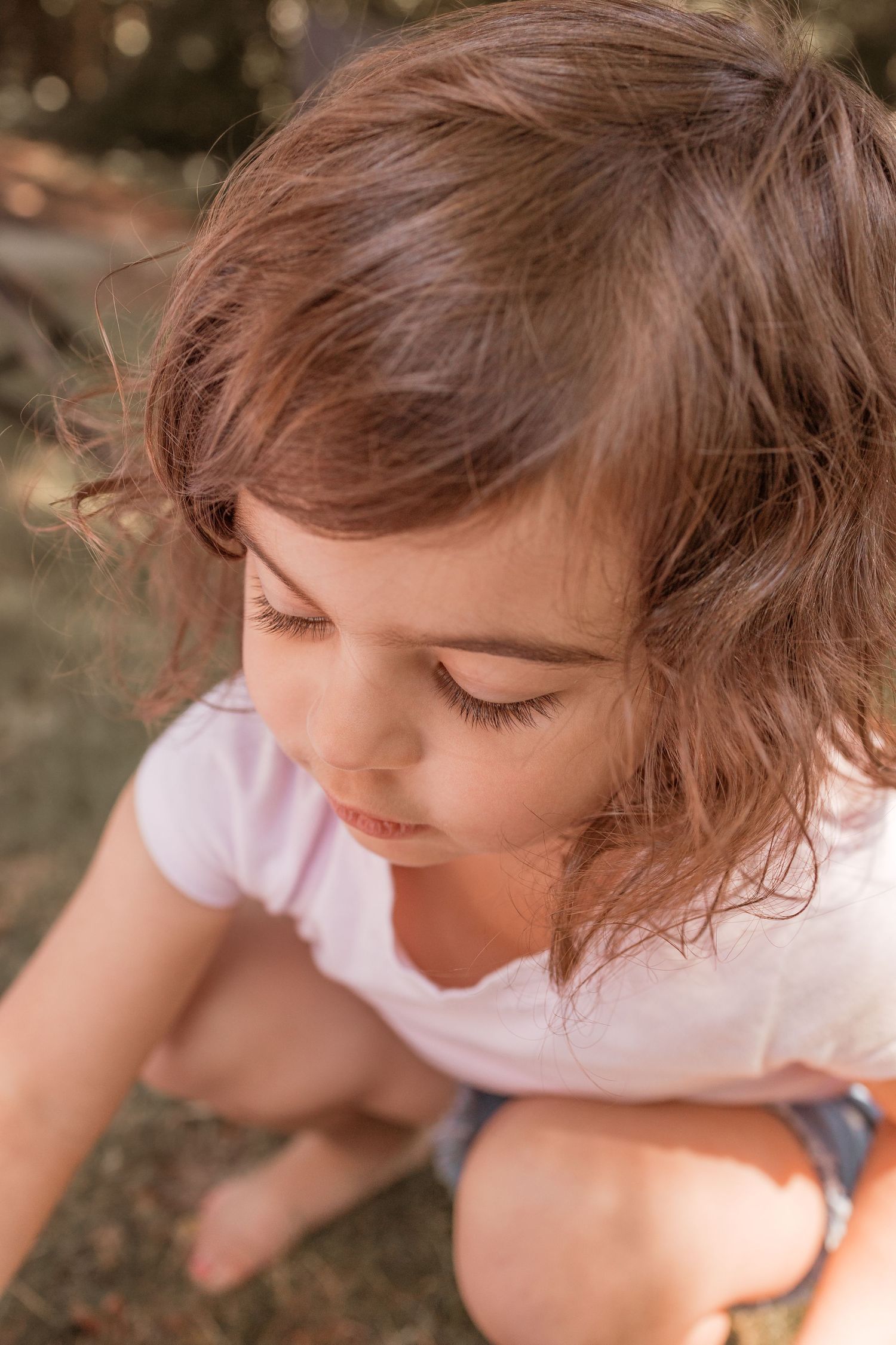 Little girl paints during a fun summer session by Rachel Martinez Photography, Michigan photographer