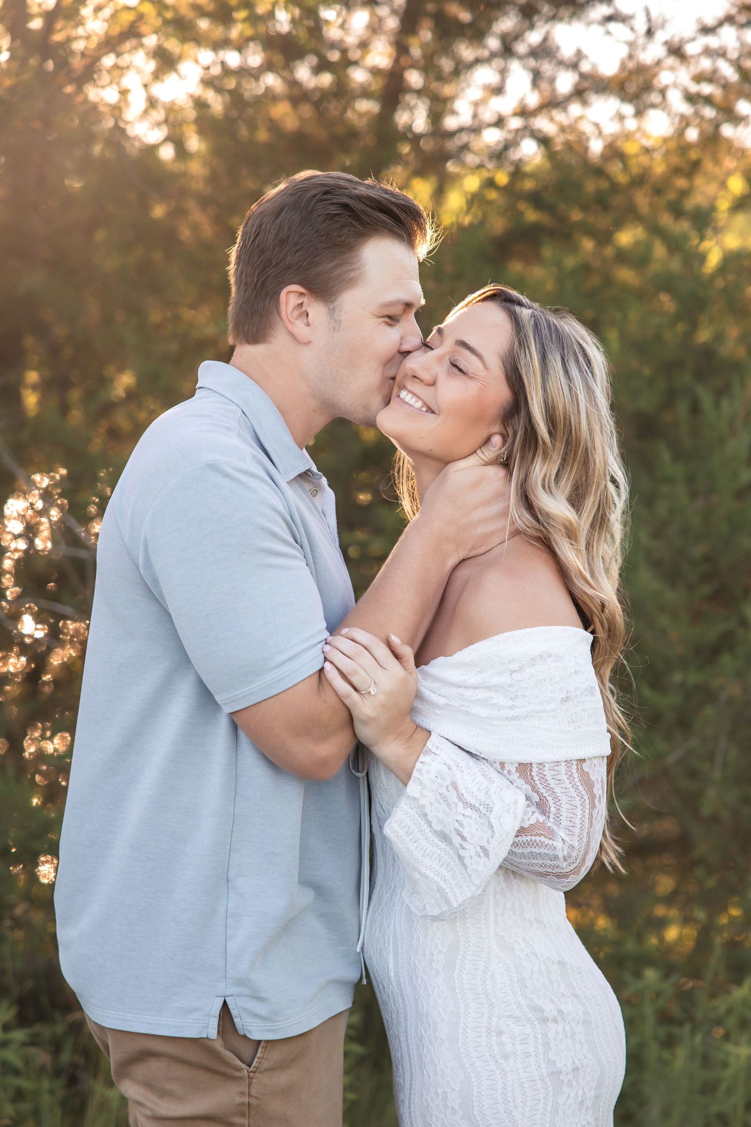 Man kisses woman's cheek at Island Lake State Park in Brighton Michigan by Rachel Martinez Photography