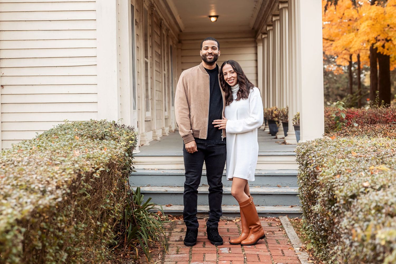 Couple poses together in the fall in Livonia at Greenmead by Rachel Martinez Photography, Michigan photographer