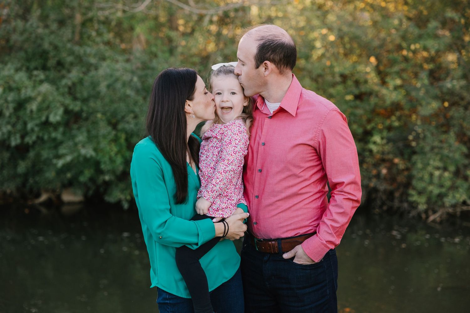 Family of three walks along the water in Northville Michigan by Rachel Martinez Photography, Michigan photographer