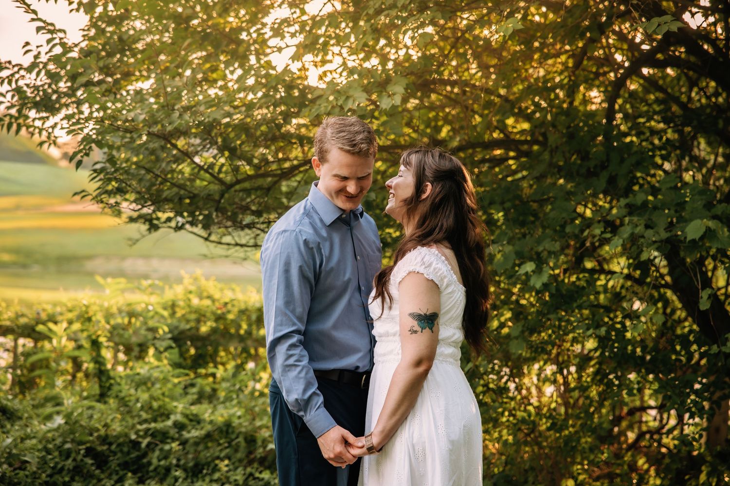 Couple holds hands in a garden at Greenmead Livonia by Rachel Martinez Photography, Michigan Wedding Photographer