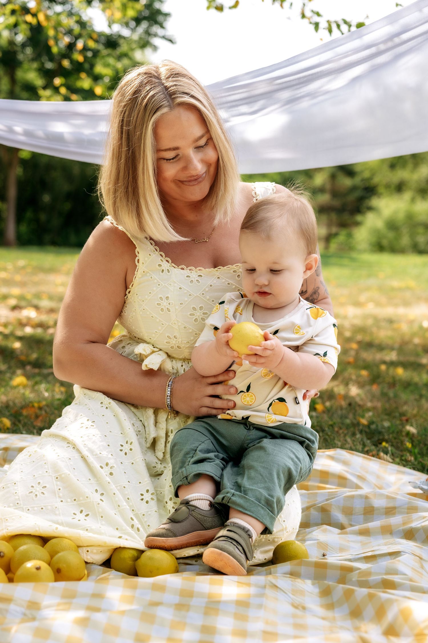 Mom and baby son sit together during mini session in Novi Michigan by Rachel Martinez Photography