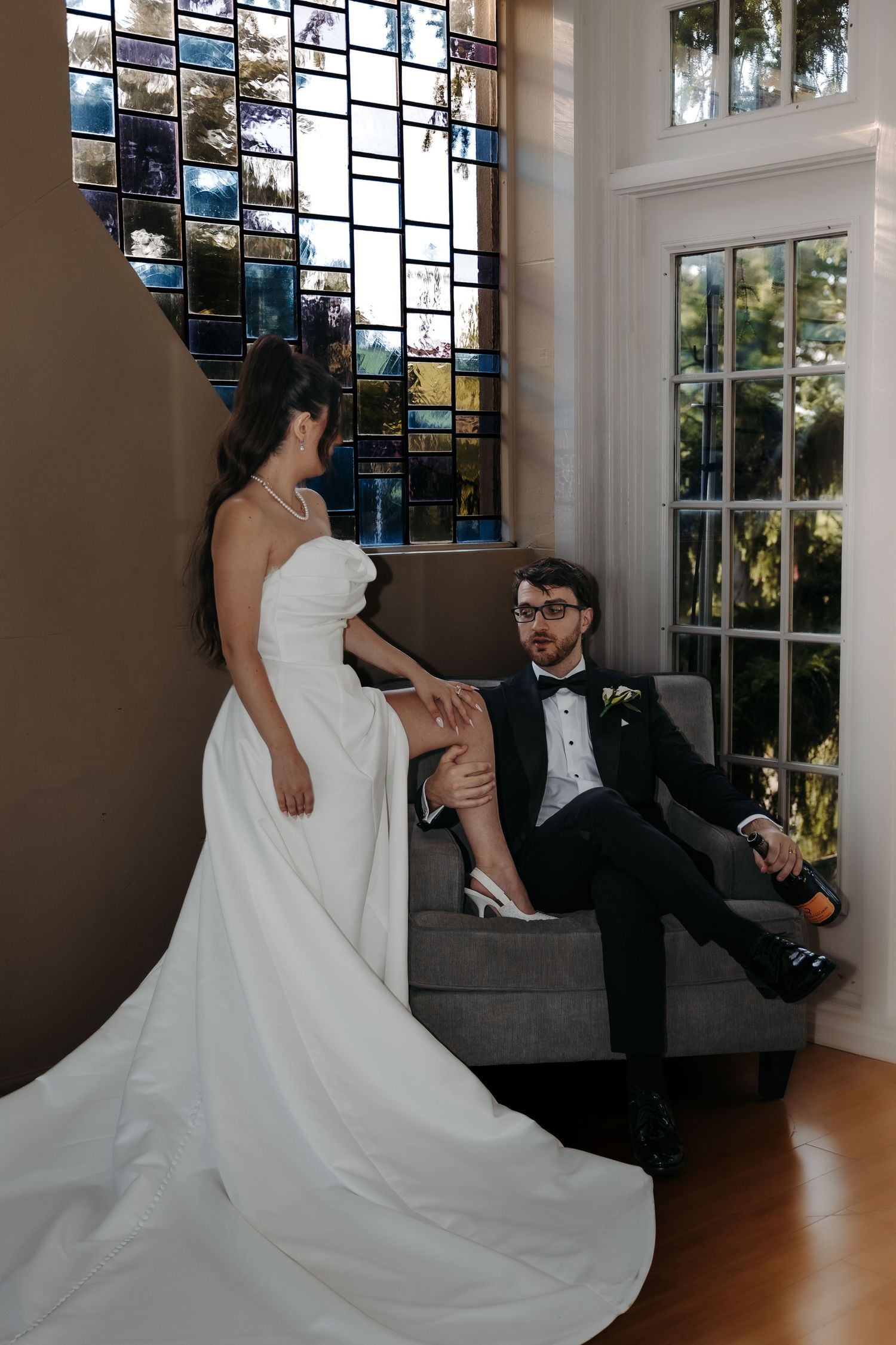 Couple poses in an editorial vibe at Pine Knob Mansion in Metro Detroit by wedding photographer Rachel Martinez Photography Novi, Michigan