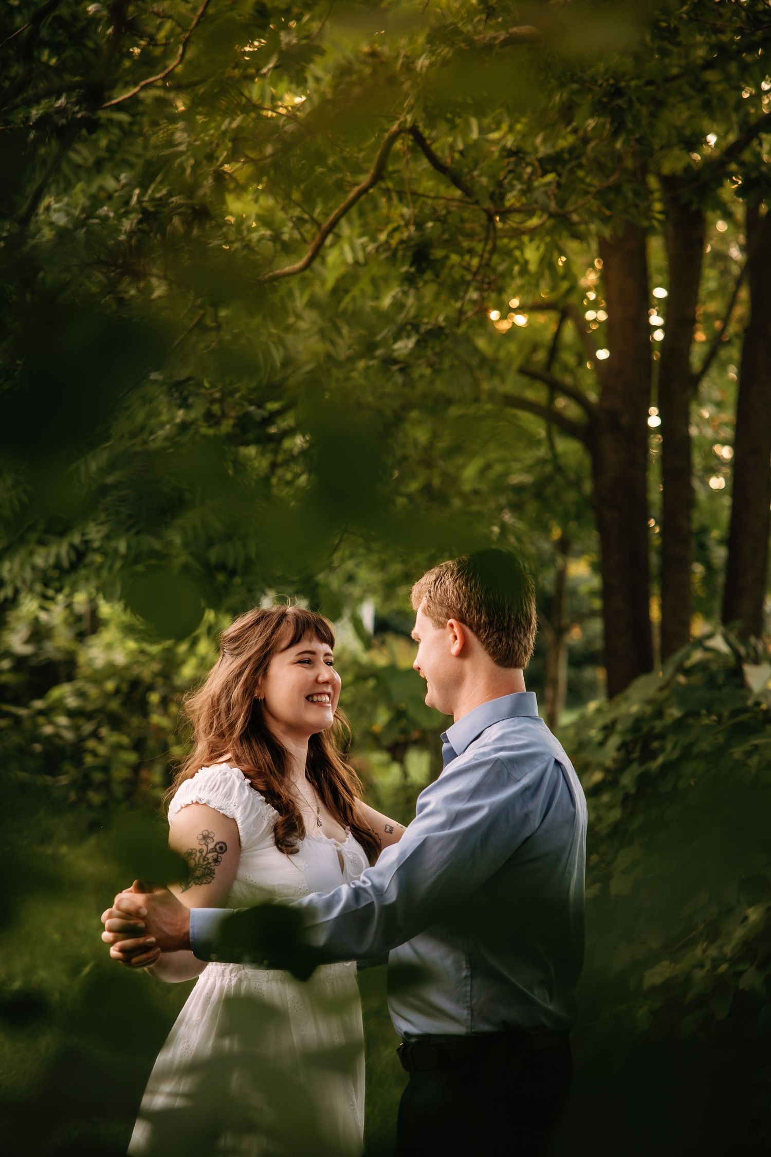 Couple dances in a garden at Greenmead Livonia by Rachel Martinez Photography, Michigan Wedding Photographer