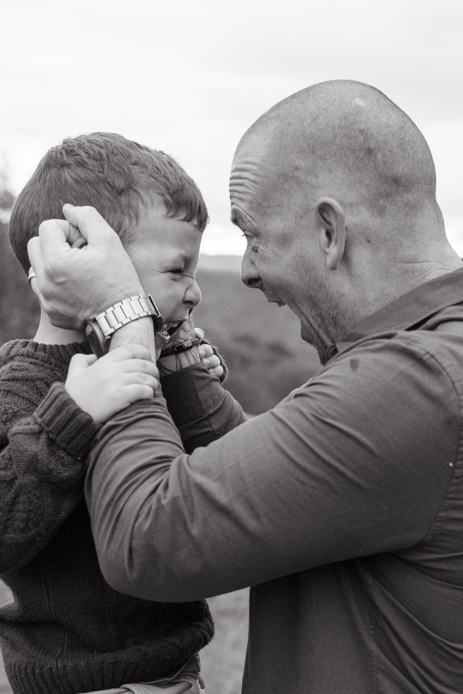 Dad lifting son