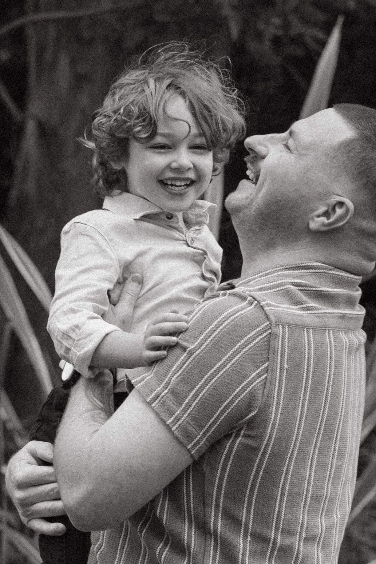 dad playing with son outside