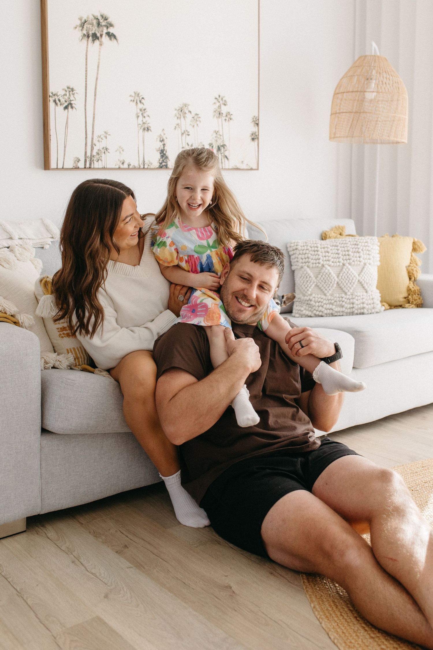 family cuddling on a couch