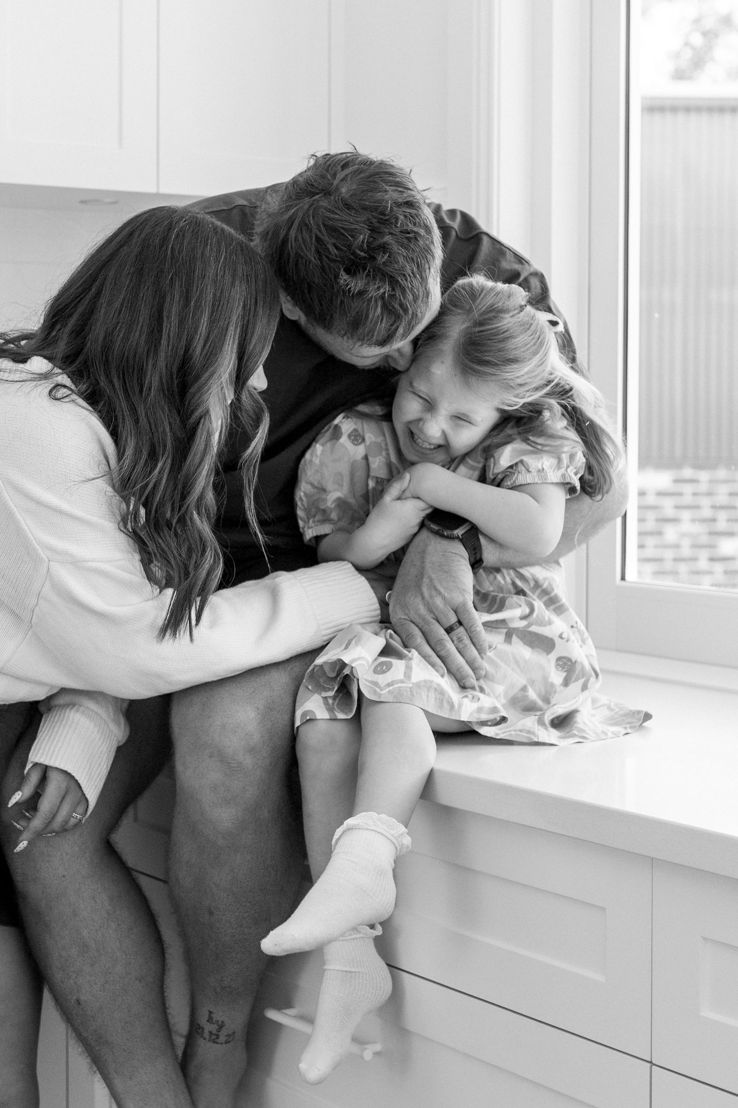 family tickling eachother