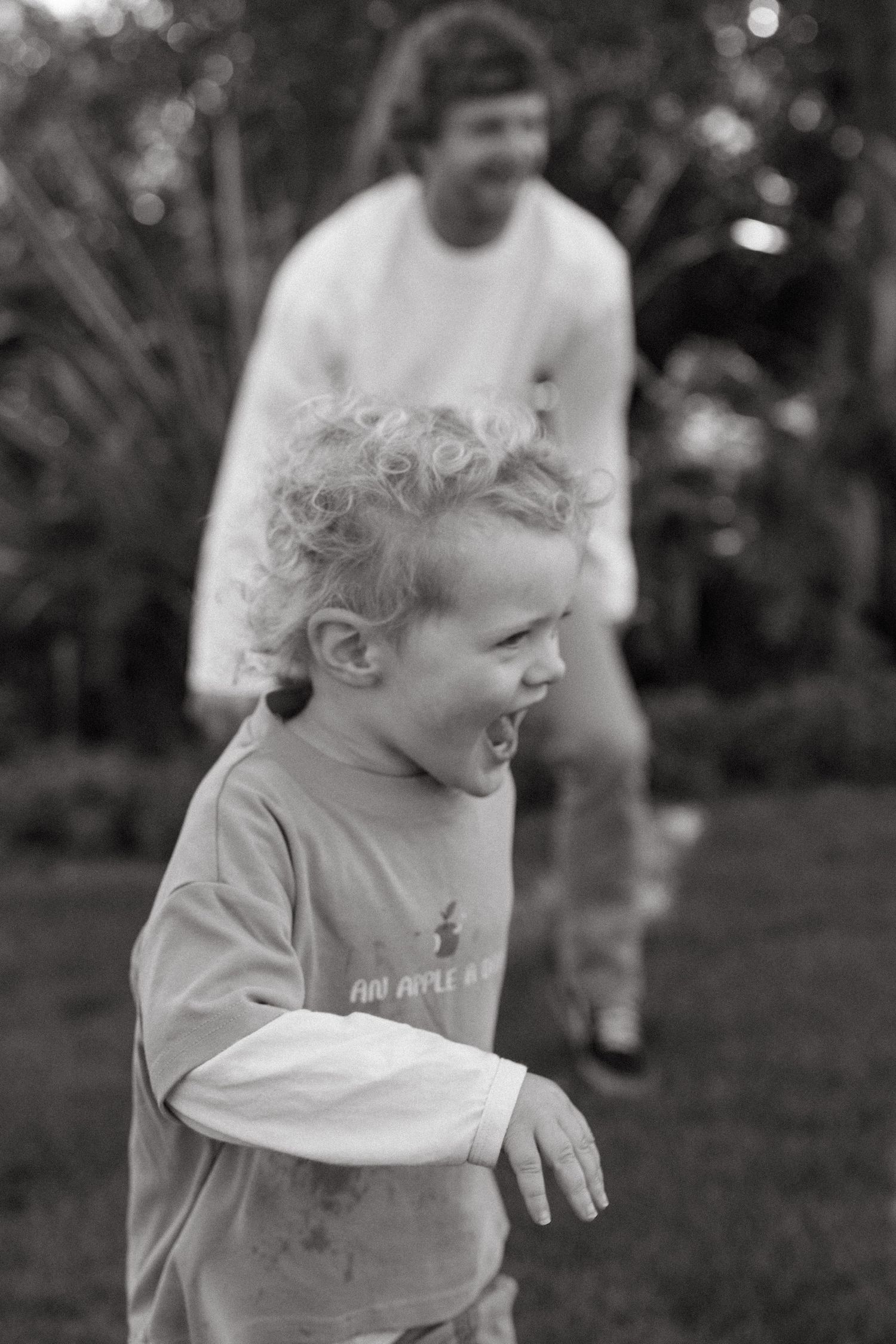 son playing with dad outside