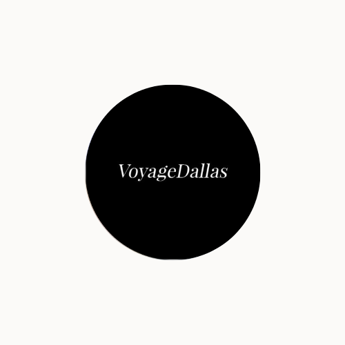 Black and white text logo reading 'VoyageDallas' in a stylized font on a white background.