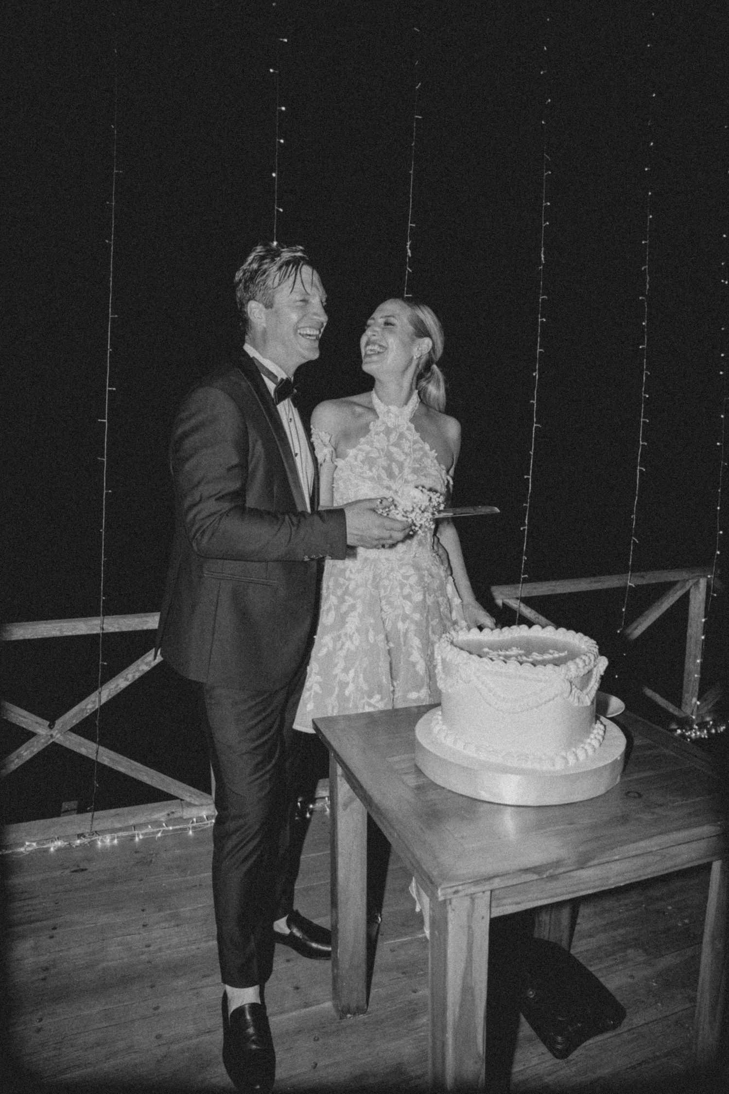 A sequence of vintage black and white photos showing a couple cutting their wedding cake during a reception celebration.