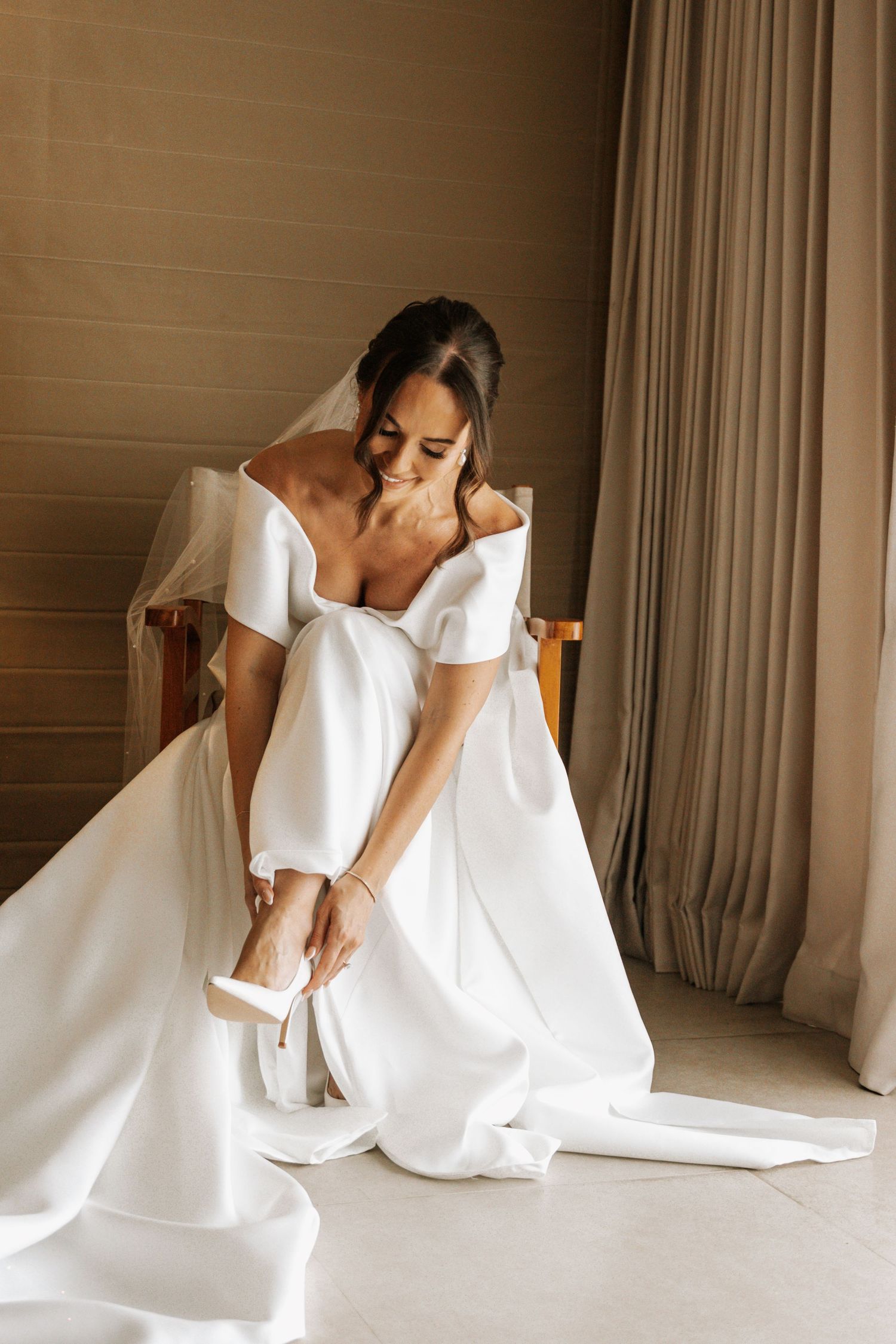 A series of artistic photos showing flowing white fabric movement against a neutral backdrop.