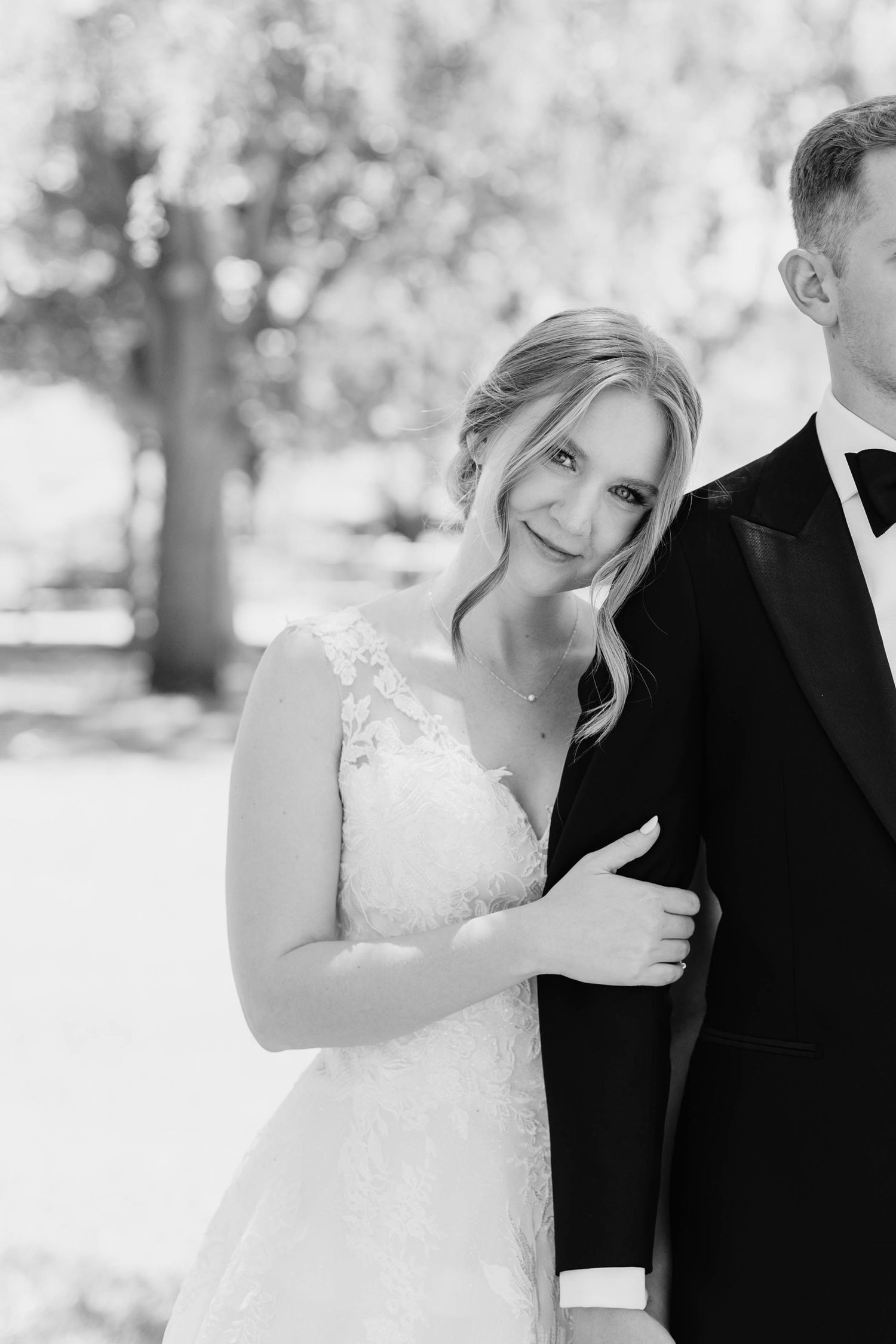 Black and white candid wedding portraits capturing joyful moments.