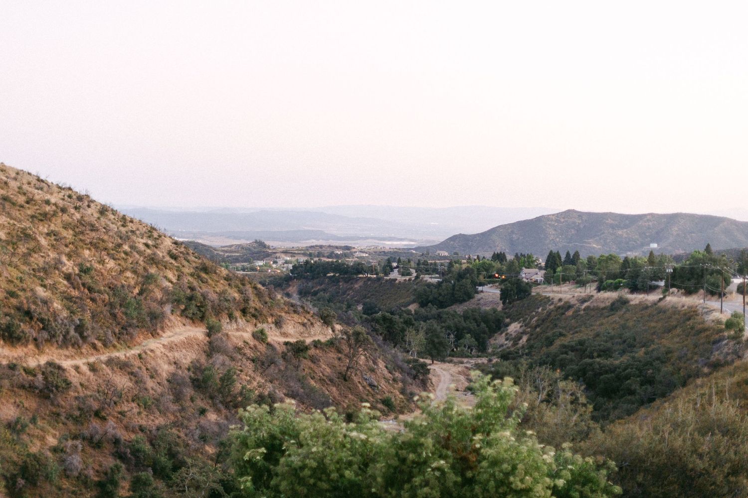 Panoramic view of desert mountains and valleys at sunset in Los Angeles California.