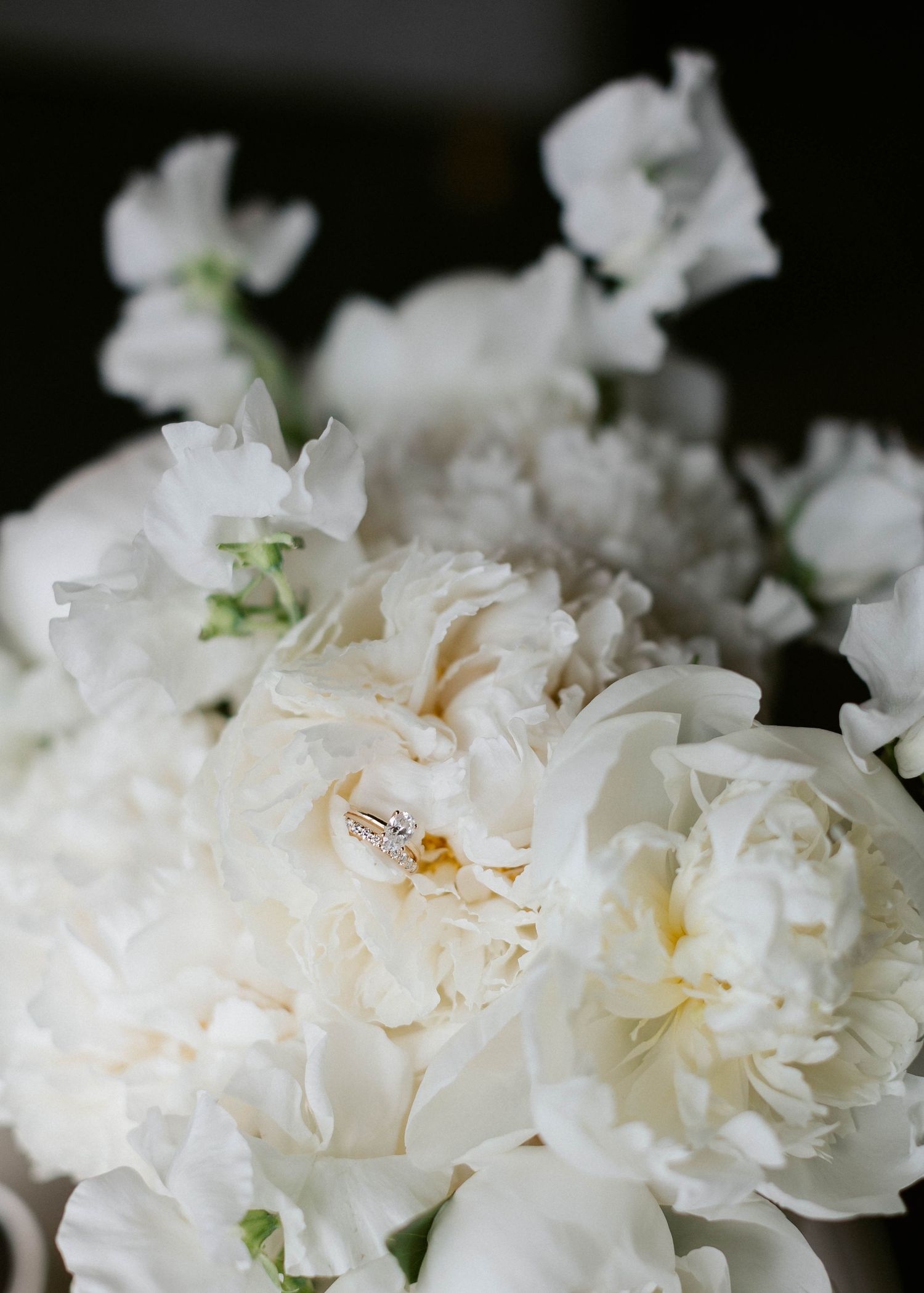 Delicate white peonies arranged in a romantic wedding bouquet.