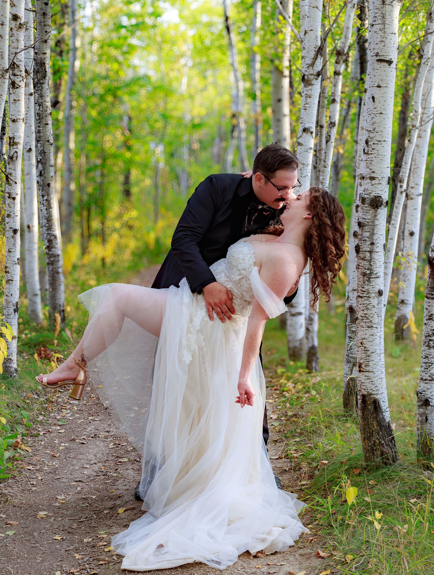 A romantic dance sequence photographed in a beautiful birch tree forest.