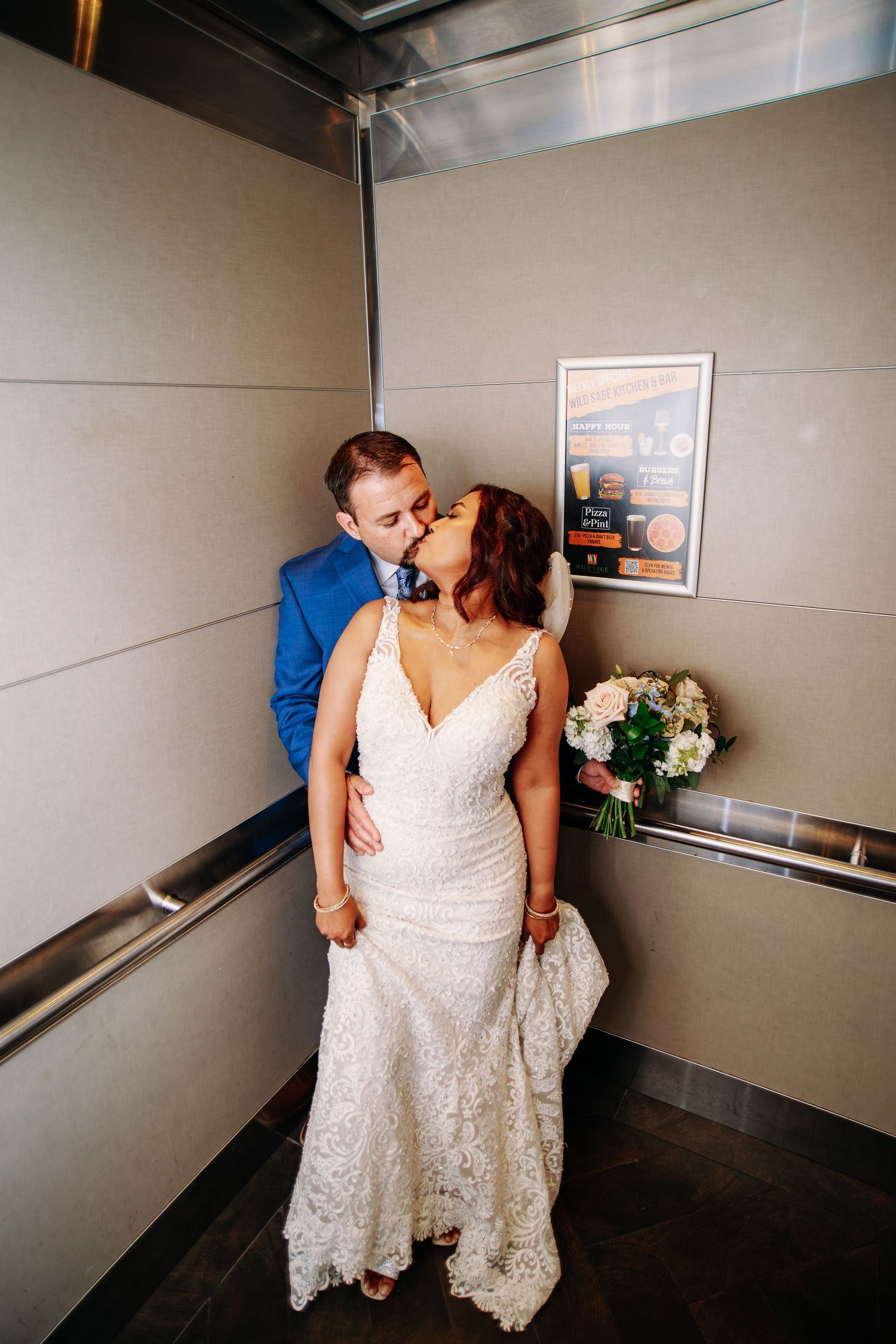 Intimate wedding moments captured in modern elevator setting.