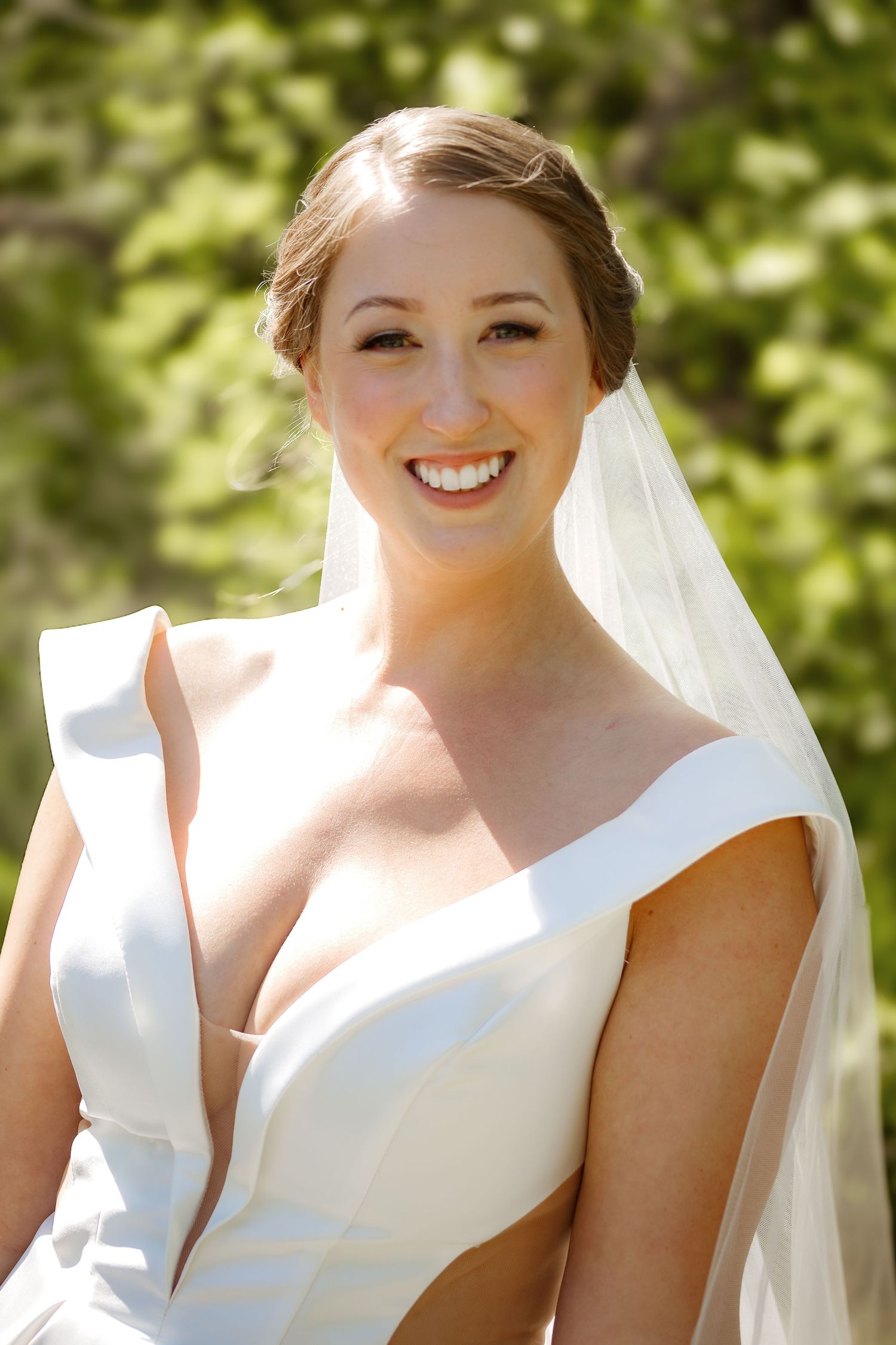 Elegant bridal portraits showcase modern white wedding dress with architectural details.