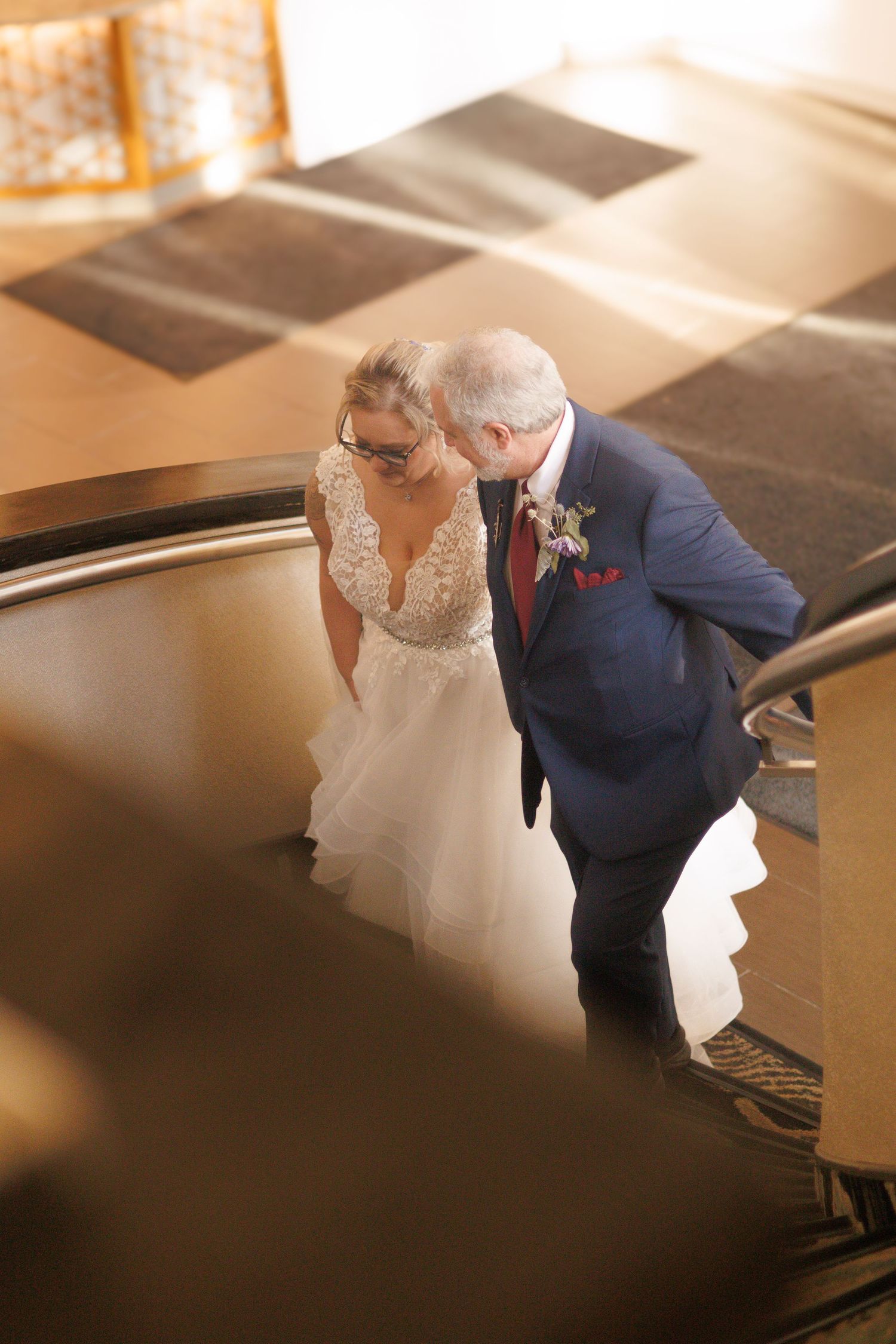 Intimate wedding portraits captured from an artistic high angle showing tender moments.