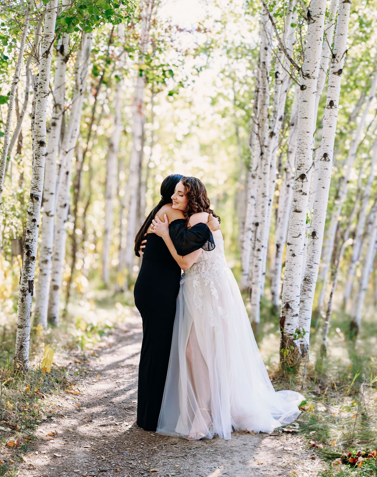 A romantic wedding photoshoot in a serene birch tree forest.