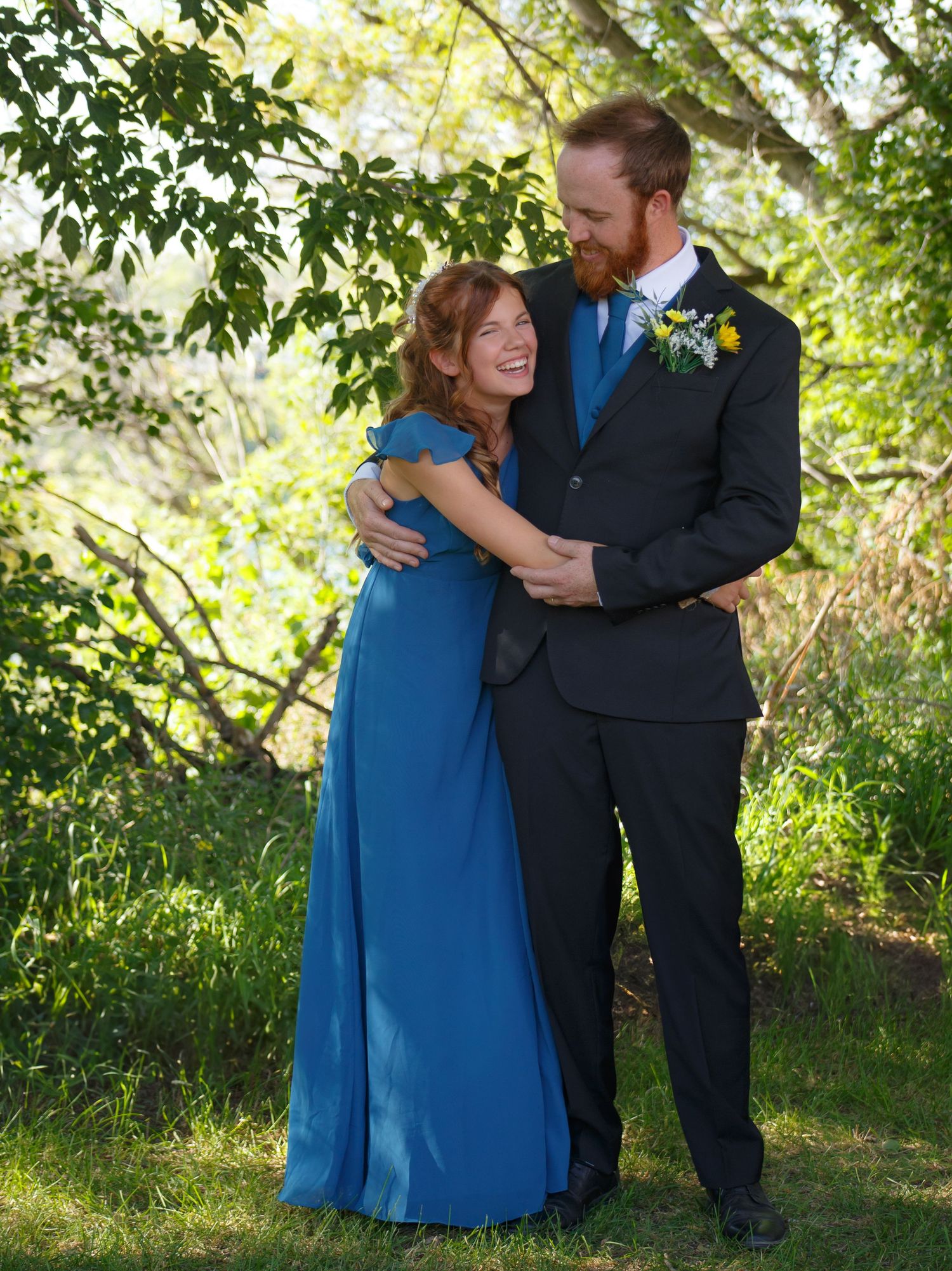 Tender embrace captured in a series of photos against lush green foliage.