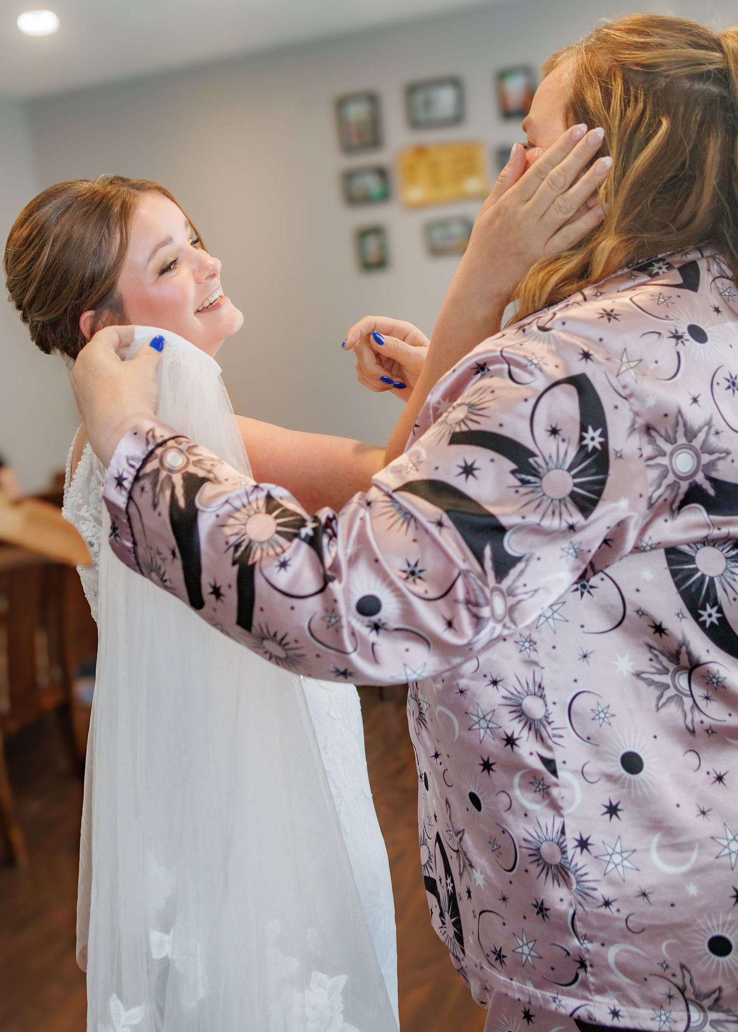 Close-up sequence of someone helping with wedding dress preparations.