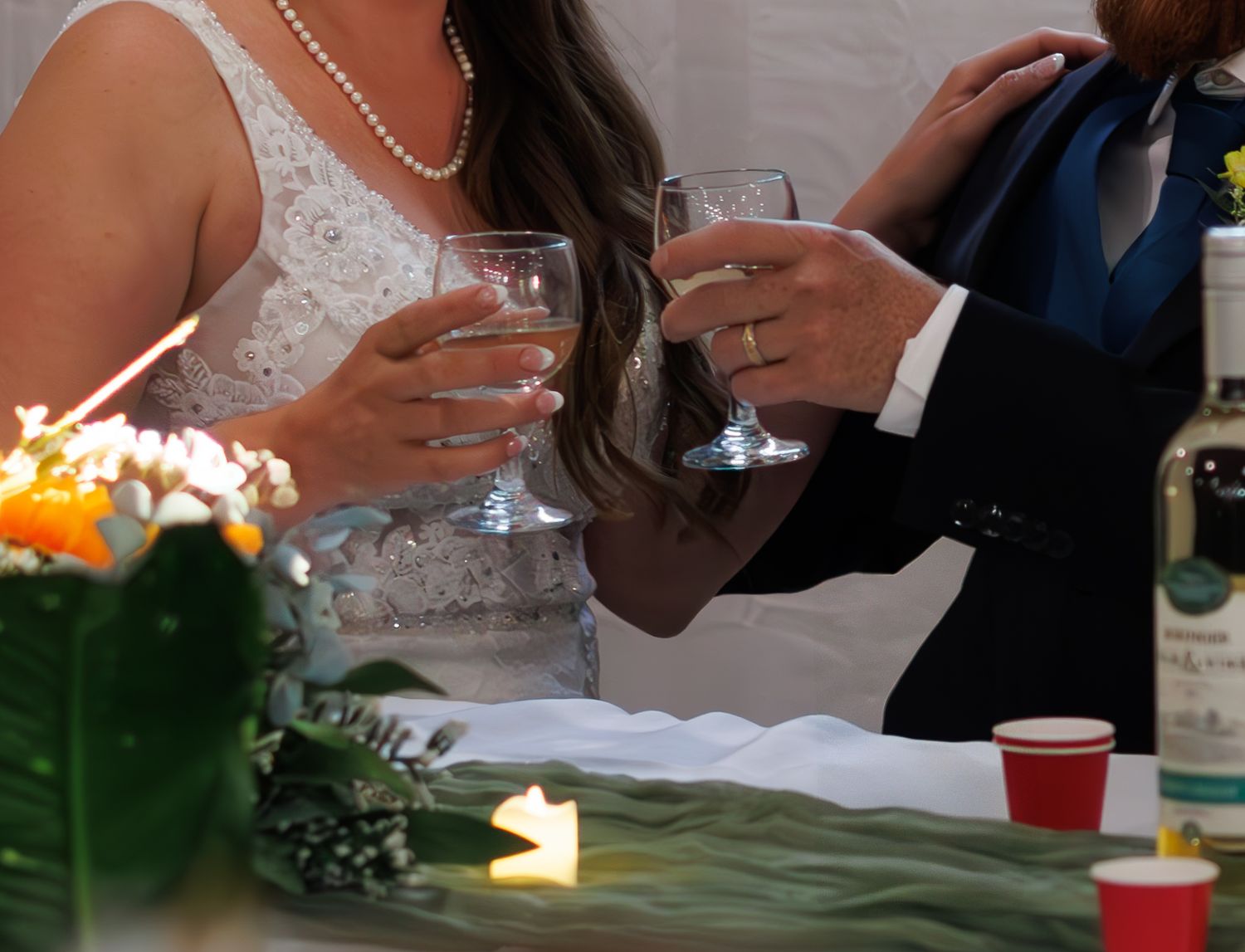 Sequence of candid moments during wedding reception toasts and celebrations.