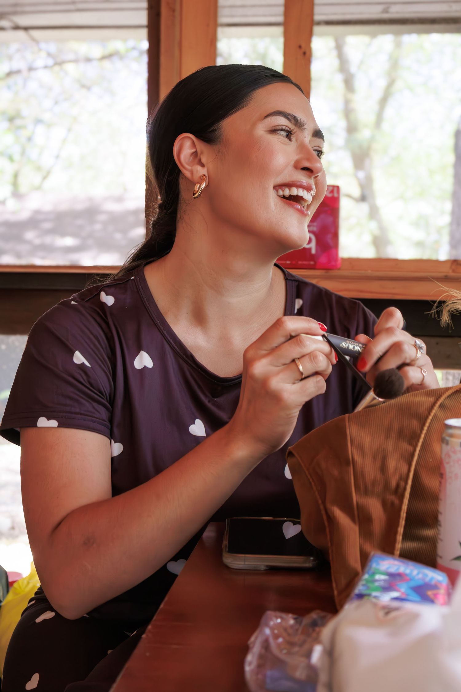 Sequence of candid moments showing joyful laughter during a wedding reception.