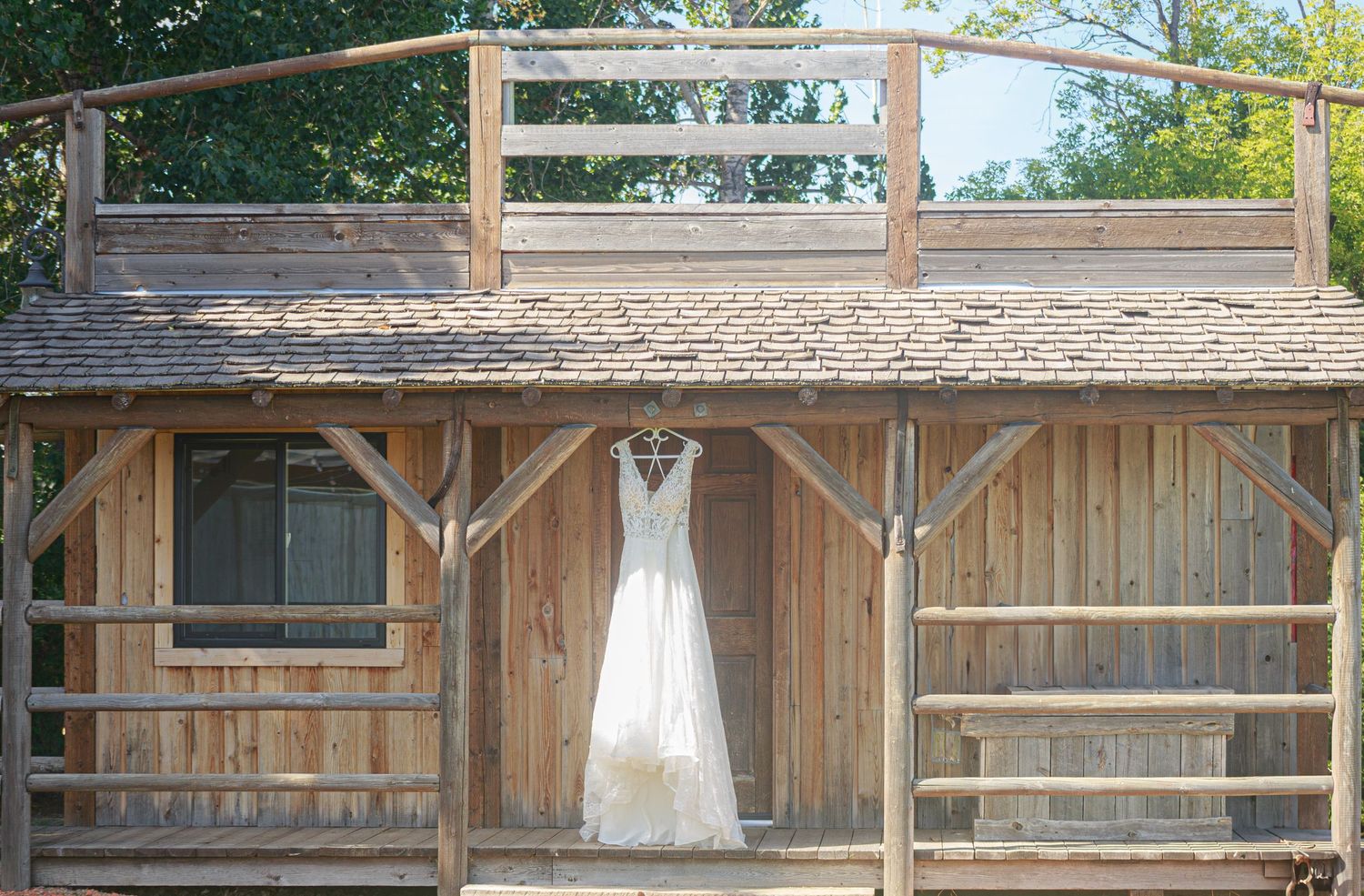 Empty rustic wooden barn interior decorated for a wedding ceremony.