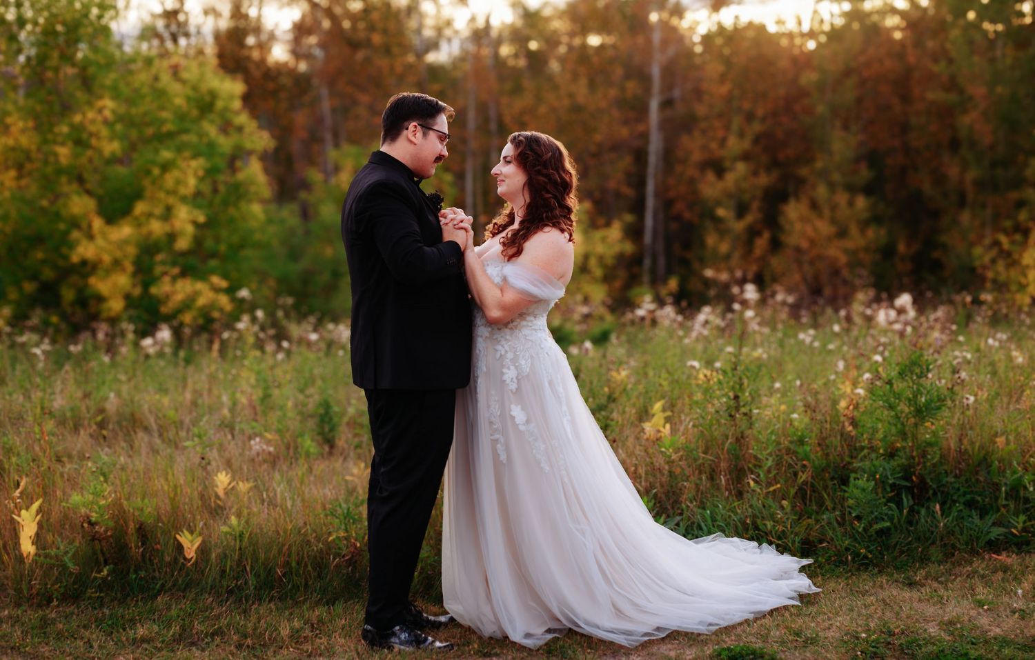 Golden hour wedding photography in a natural outdoor setting.