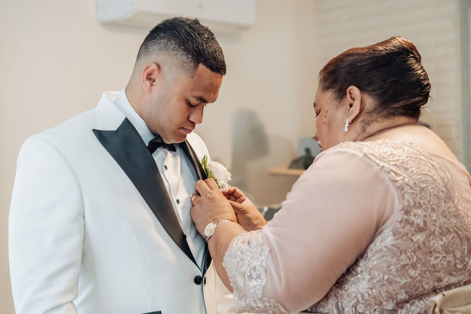 A bride and groom share a sweet moment during their wedding ceremony as they feed each other cake.