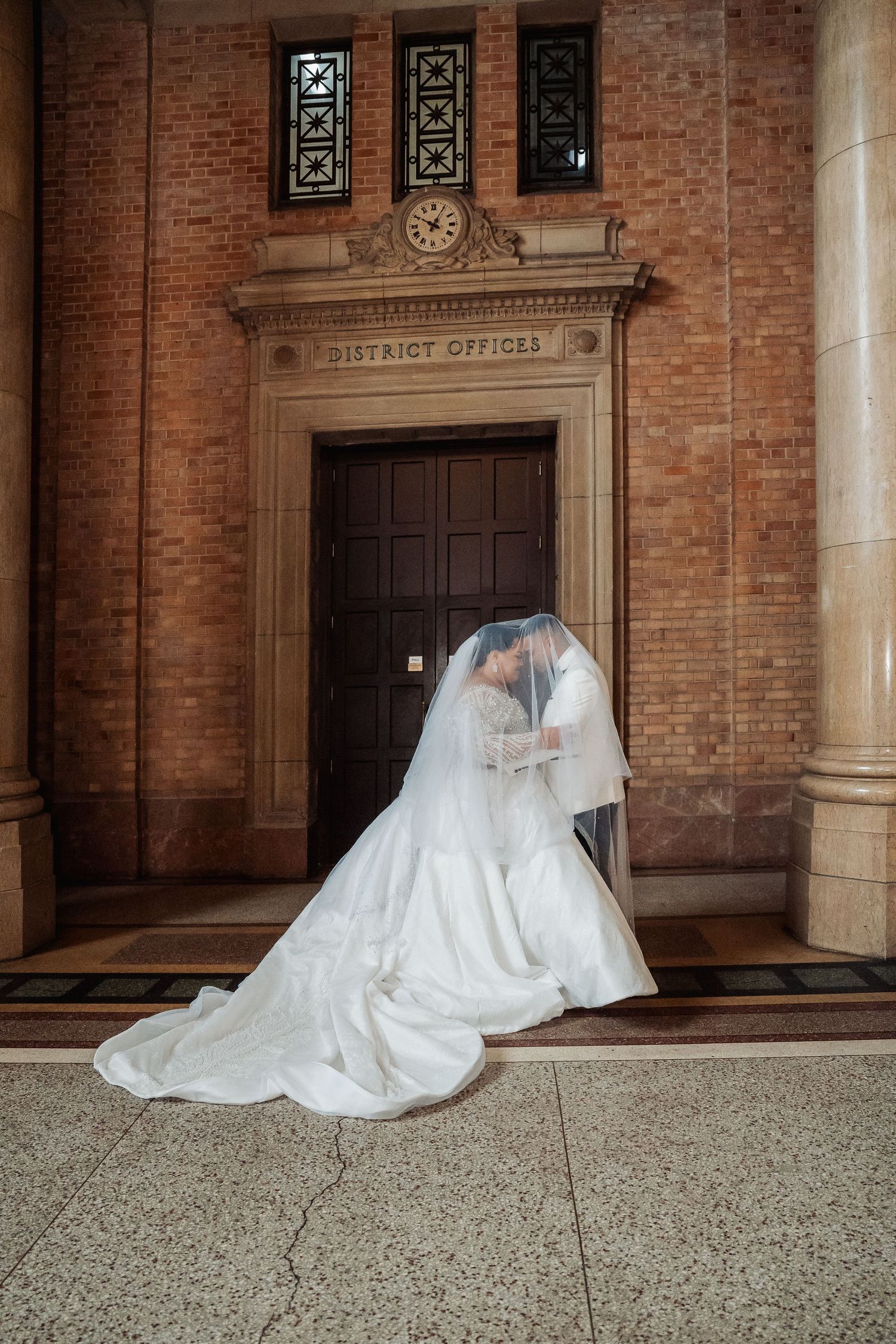 A series of artistic wedding gown poses shown in six sequential frames along a brick building entrance.