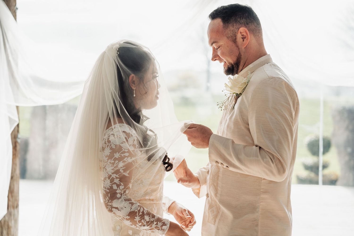 Romantic first dance moments captured in a light-filled wedding venue.