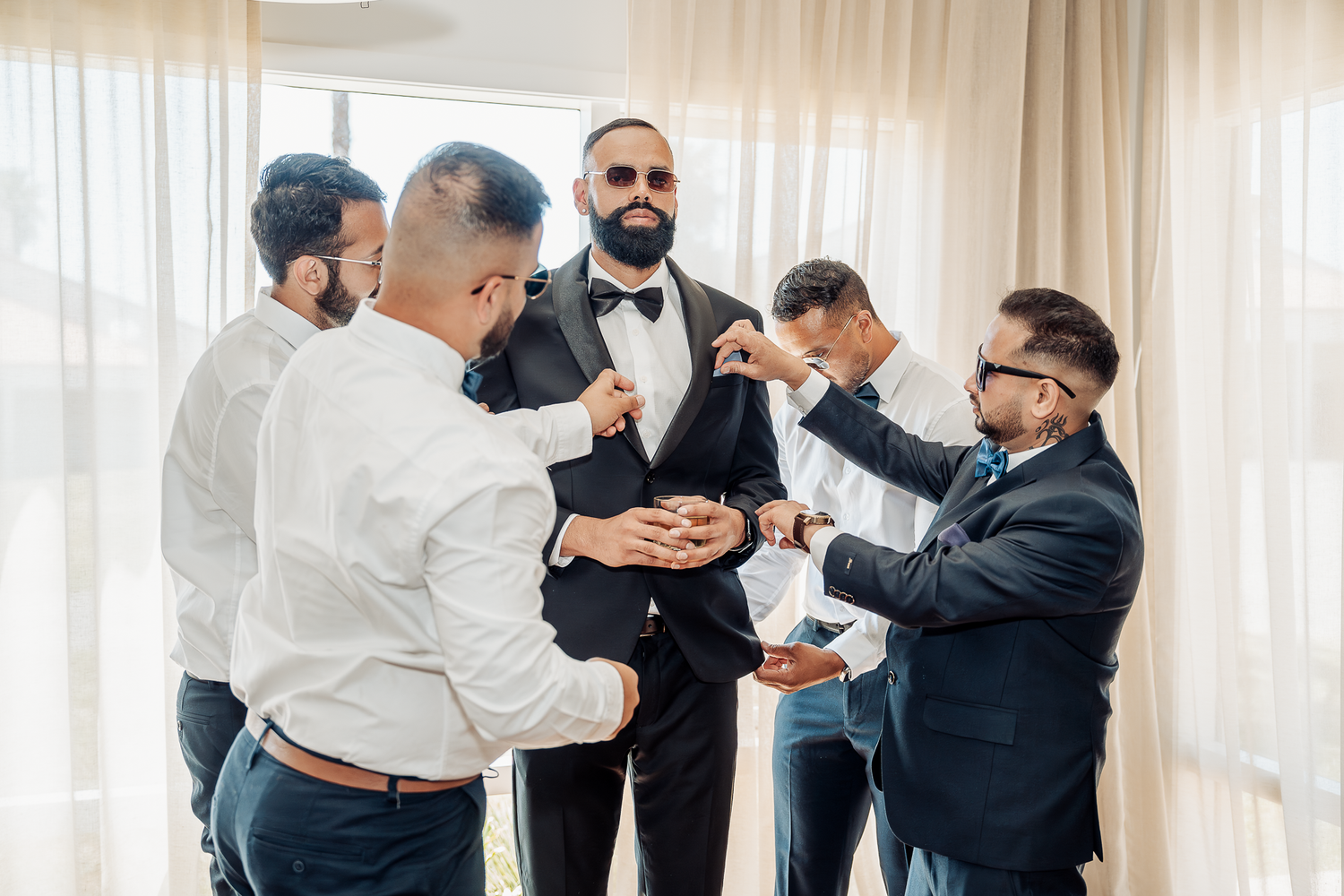 Getting ready scene with formal attire and preparations before the ceremony.