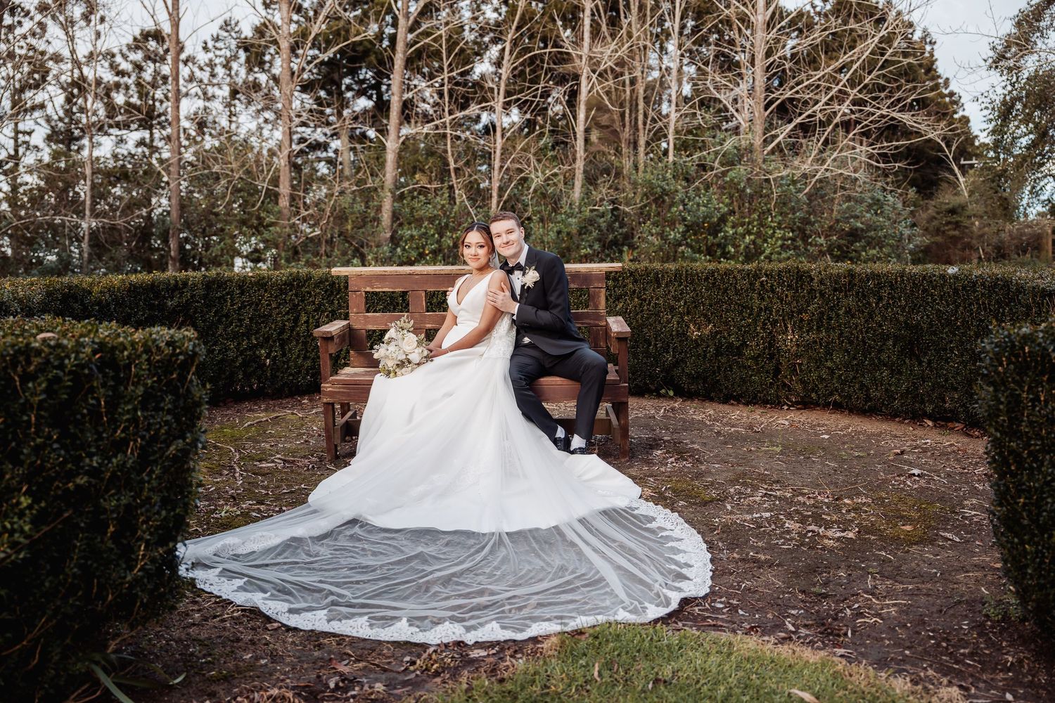 Beautiful garden wedding setting with stone pathways and lush landscaping.