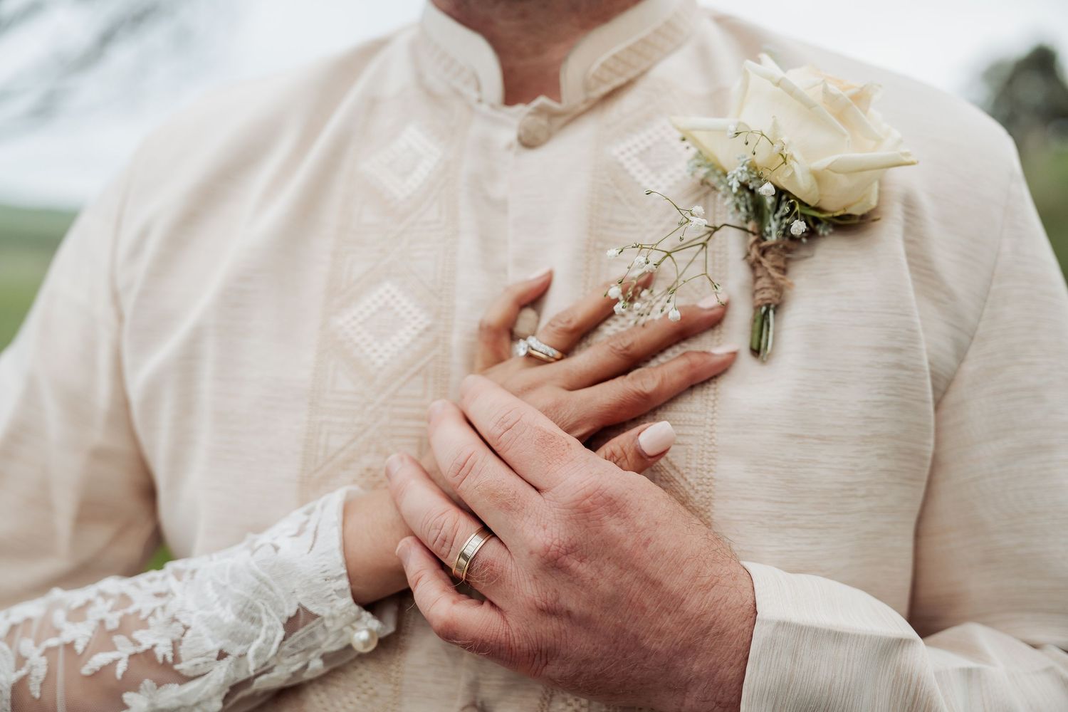 Close-up details of wedding rings and hands showing romantic moments.