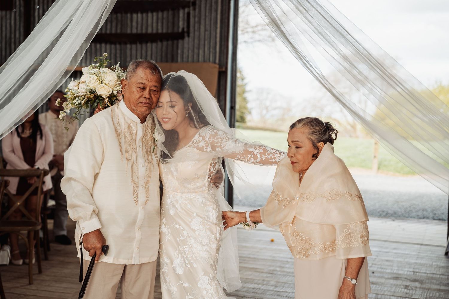 Wedding ceremony moments captured in a bright, airy indoor venue.