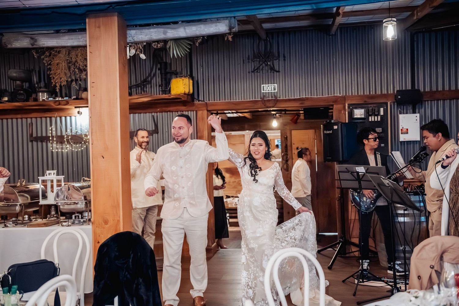 Wedding reception celebration in an industrial-chic venue with modern decor.